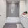 Downtown Los Angeles, CA, Pet-Friendly Luxury Apartments - AVEN - Bathroom with Tile Flooring, White Finishes, Subway Tile Backsplash and Shower Surrounds, and Large Vanity with Cabinets.