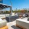 1-Bedroom Apartments in Downtown Los Angeles, CA - AVEN - Skydeck with Lounge Seating, Central Fire Pit, Large Pergola, String Lights, and Landscaping.